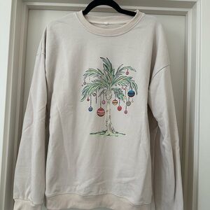 Festive Cream Holiday Sweatshirt with Palm Tree Ornament Design